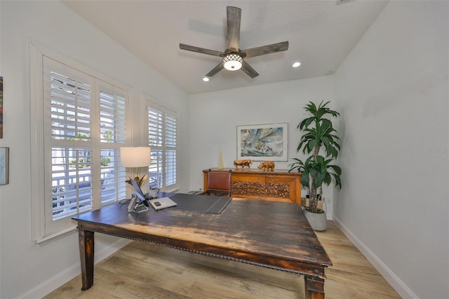 office featuring light wood-style floors, ceiling fan, baseboards, and recessed lighting