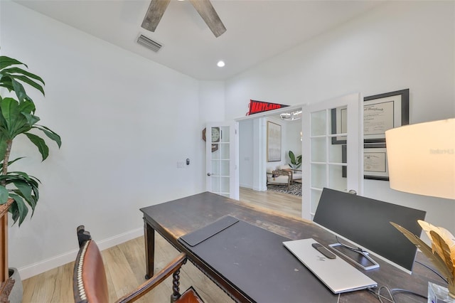 office space with french doors, visible vents, a ceiling fan, wood finished floors, and baseboards