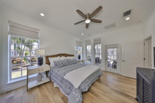 bedroom with light wood-type flooring, recessed lighting, visible vents, and ornamental molding