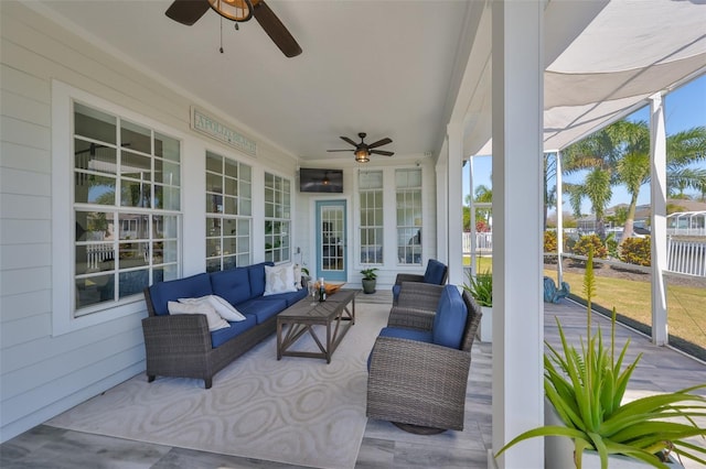 sunroom with ceiling fan