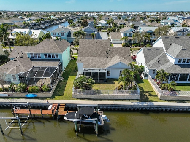 aerial view with a water view and a residential view