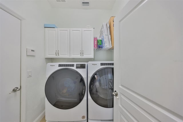413 Islebay Dr, Apollo Beach, FL 33572 - laundry area with cabinet space and washing machine and clothes dryer