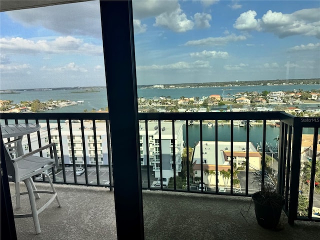 balcony featuring a water view