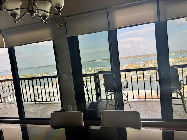 interior space with a water view and an inviting chandelier