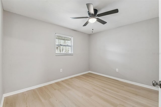 unfurnished room featuring light wood-type flooring, ceiling fan, and baseboards