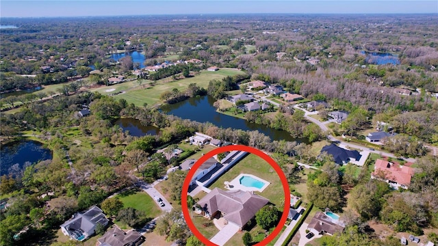 birds eye view of property with a water view