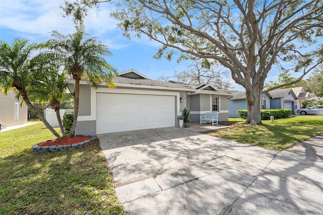 single story home featuring brick siding, stucco siding, a front yard, a garage, and driveway