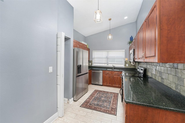 2519 Southern Oak Cir, Clearwater, FL 33764 - kitchen featuring a sink, vaulted ceiling, appliances with stainless steel finishes, decorative backsplash, and pendant lighting