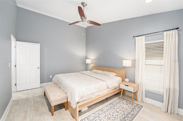 2519 Southern Oak Cir, Clearwater, FL 33764 - bedroom featuring a ceiling fan, vaulted ceiling, light wood-style flooring, and baseboards