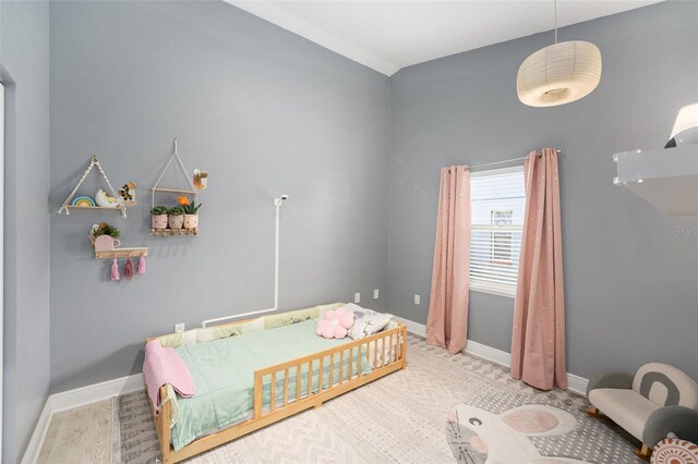 2519 Southern Oak Cir, Clearwater, FL 33764 - bedroom featuring baseboards and wood finished floors