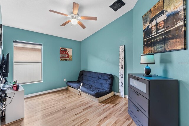 31123 Stone Arch Ave, Wesley Chapel, FL 33545 - sitting room with a ceiling fan, visible vents, vaulted ceiling, baseboards, and light wood-type flooring