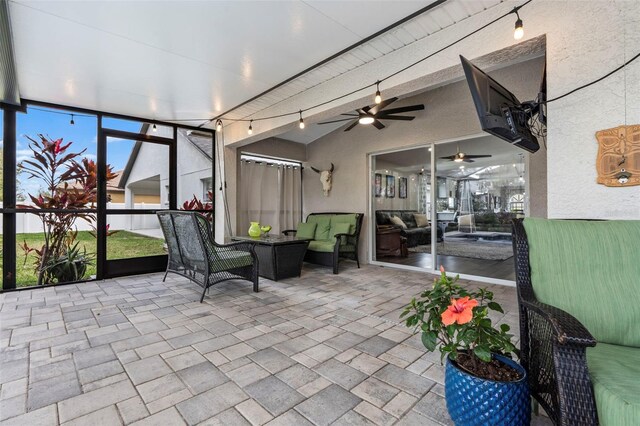 31123 Stone Arch Ave, Wesley Chapel, FL 33545 - sunroom featuring vaulted ceiling with beams