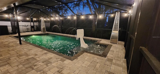 31123 Stone Arch Ave, Wesley Chapel, FL 33545 - view of swimming pool featuring a fenced in pool, glass enclosure, a patio area, and fence