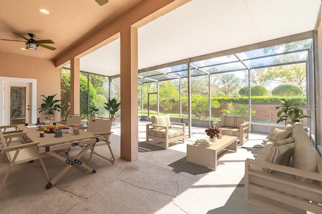 sunroom / solarium featuring plenty of natural light and a ceiling fan