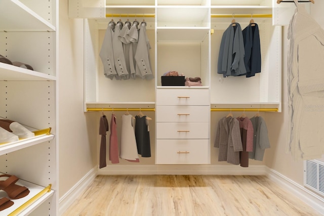 walk in closet with visible vents and light wood finished floors