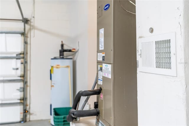 interior space featuring water heater and heating unit