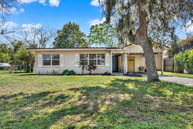 ranch-style house with fence and a front yard