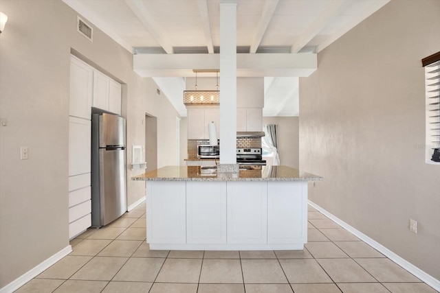 kitchen with tasteful backsplash, visible vents, appliances with stainless steel finishes, light tile patterned flooring, and white cabinetry