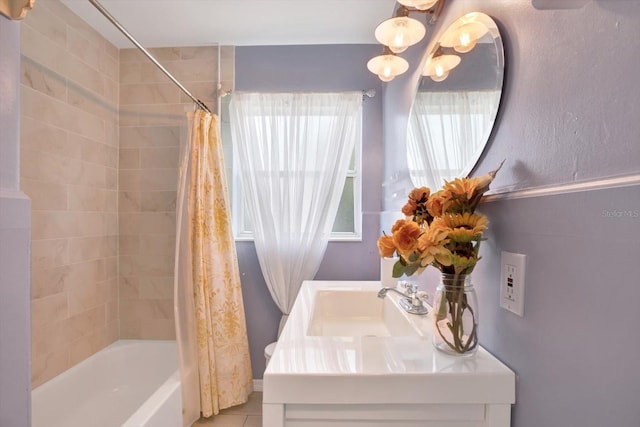 bathroom featuring shower / bathtub combination with curtain, vanity, and tile patterned floors