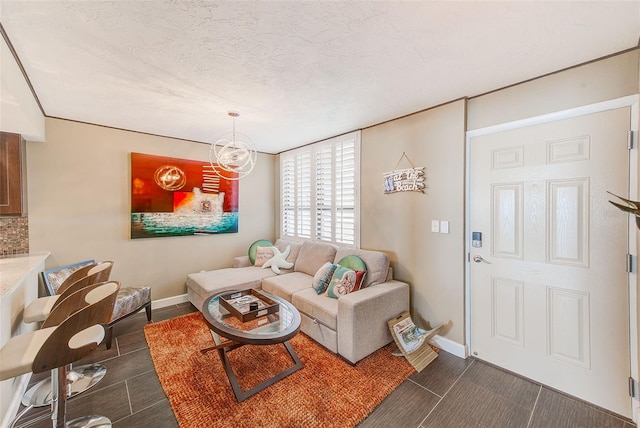 living room with baseboards and a textured ceiling