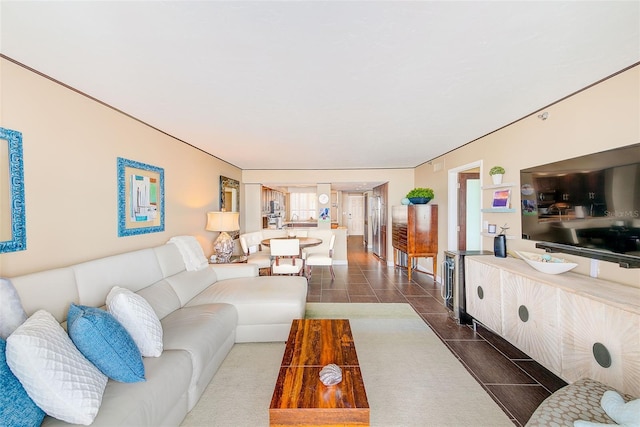 living room with dark tile patterned floors