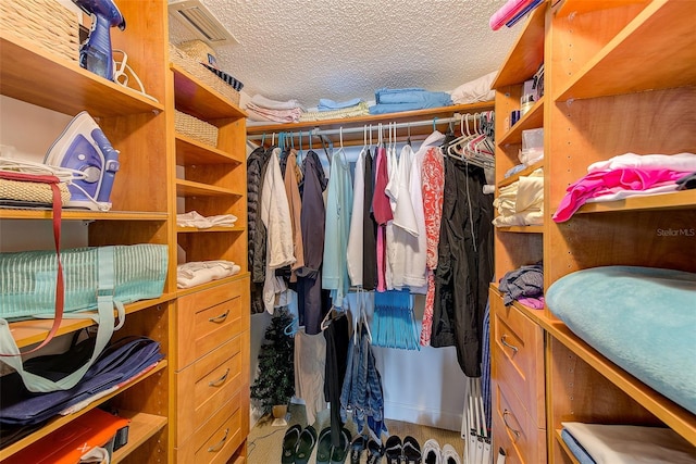 spacious closet featuring visible vents