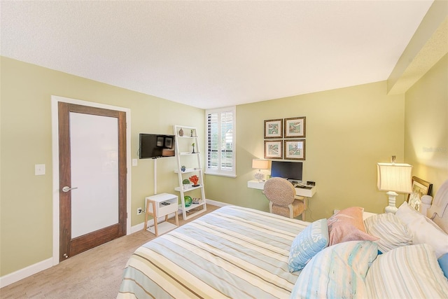 bedroom featuring baseboards and carpet flooring