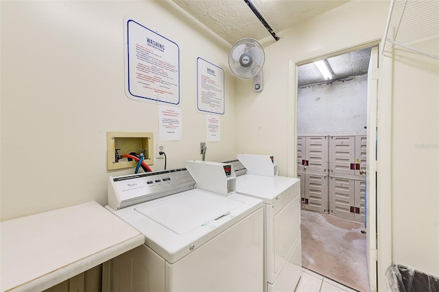 community laundry room featuring washing machine and dryer