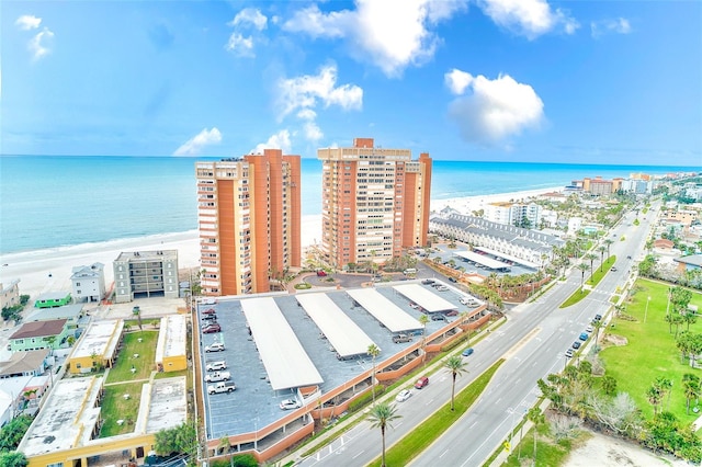 birds eye view of property featuring a water view and a city view