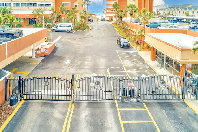 view of street featuring a gate and a gated entry