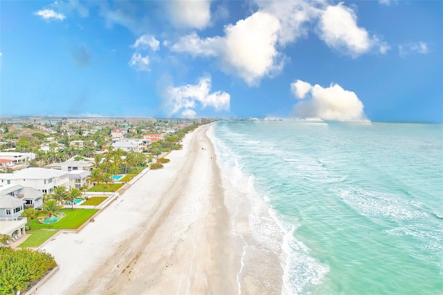 drone / aerial view featuring a water view and a view of the beach