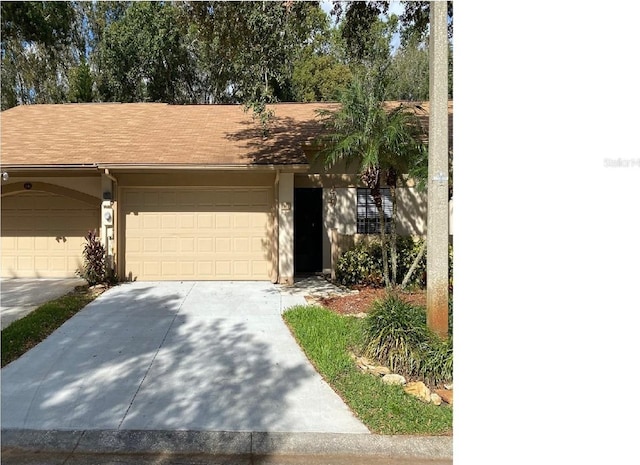 view of front of property with driveway and stucco siding