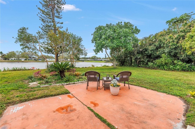 view of patio with a water view