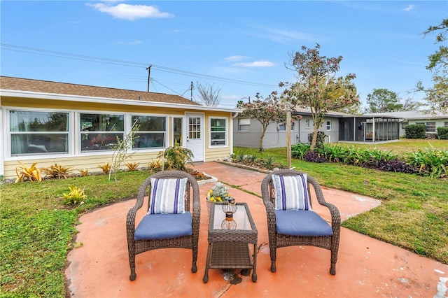 view of patio with a sunroom