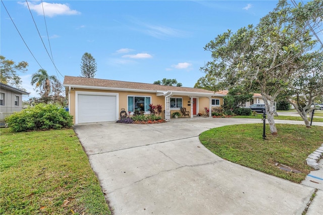 ranch-style home with curved driveway, an attached garage, a front lawn, and stucco siding