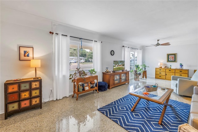 4322 22nd Ave N, Saint Petersburg, FL 33713 - living room featuring speckled floor, baseboards, and a ceiling fan