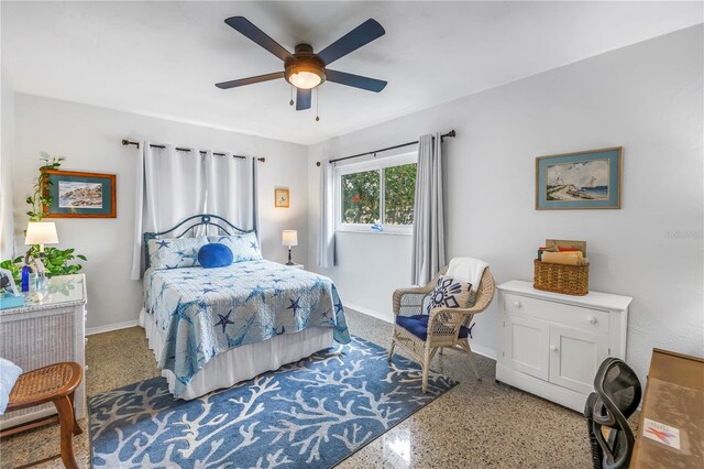 4322 22nd Ave N, Saint Petersburg, FL 33713 - bedroom with speckle patterned floor, baseboards, and ceiling fan