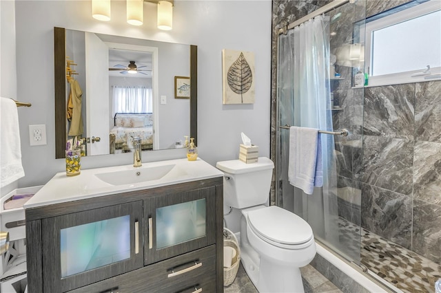 4322 22nd Ave N, Saint Petersburg, FL 33713 - full bathroom featuring a stall shower, toilet, connected bathroom, vanity, and ceiling fan