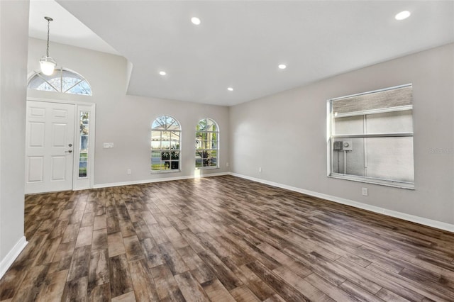 entryway featuring recessed lighting, dark wood finished floors, and baseboards