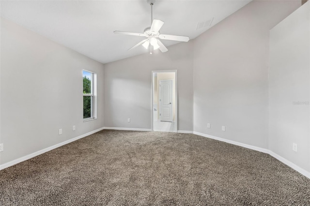 carpeted spare room featuring lofted ceiling, ceiling fan, visible vents, and baseboards