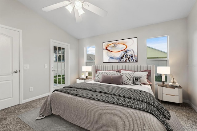 bedroom with carpet floors, multiple windows, vaulted ceiling, and baseboards