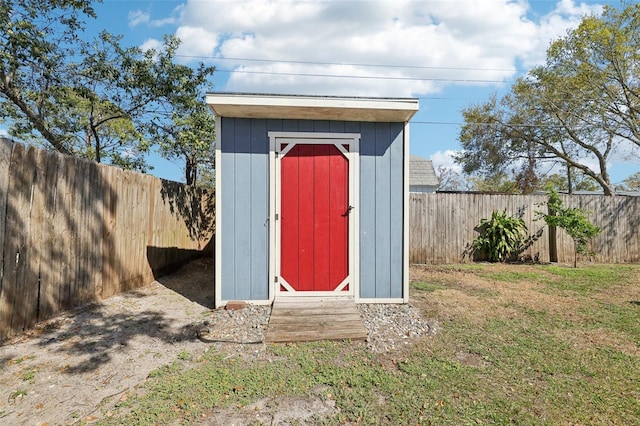 view of shed with a fenced backyard