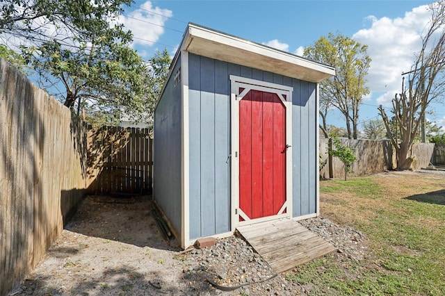 view of shed featuring a fenced backyard