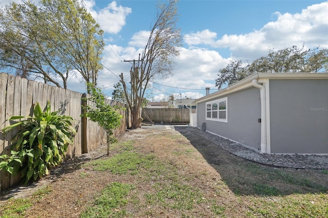 view of yard with a fenced backyard