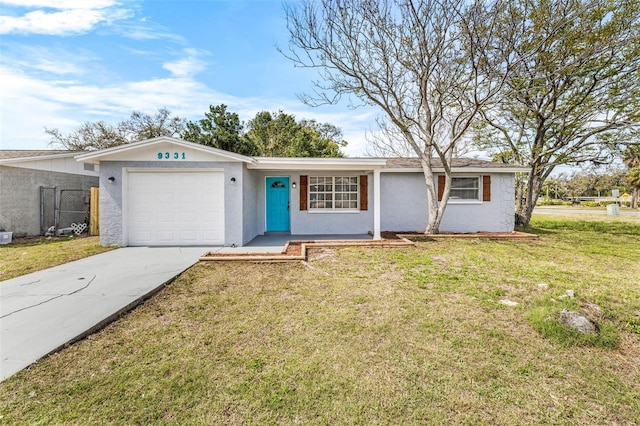 single story home featuring a garage, concrete driveway, fence, a front lawn, and stucco siding