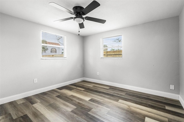 unfurnished room with ceiling fan, baseboards, and wood finished floors