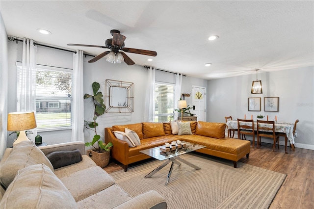 living room with ceiling fan, baseboards, wood finished floors, and recessed lighting