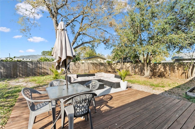 deck featuring an outdoor hangout area and a fenced backyard