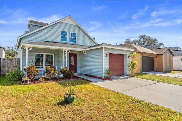 view of front of home with concrete driveway, an attached garage, fence, a front lawn, and a porch