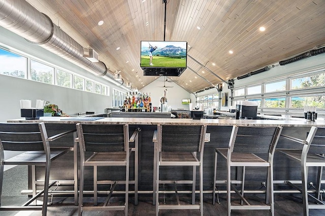 bar featuring recessed lighting, wood ceiling, vaulted ceiling, and a dry bar